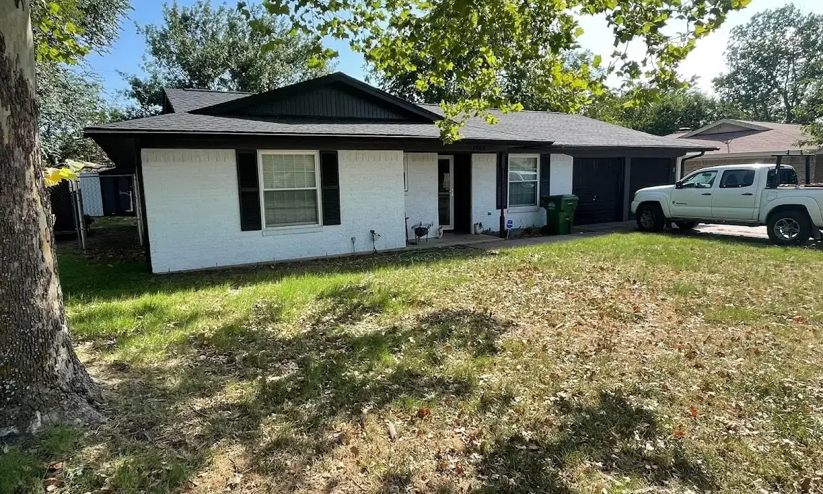 Professional roofing crew working on a residential roof in Montrose
